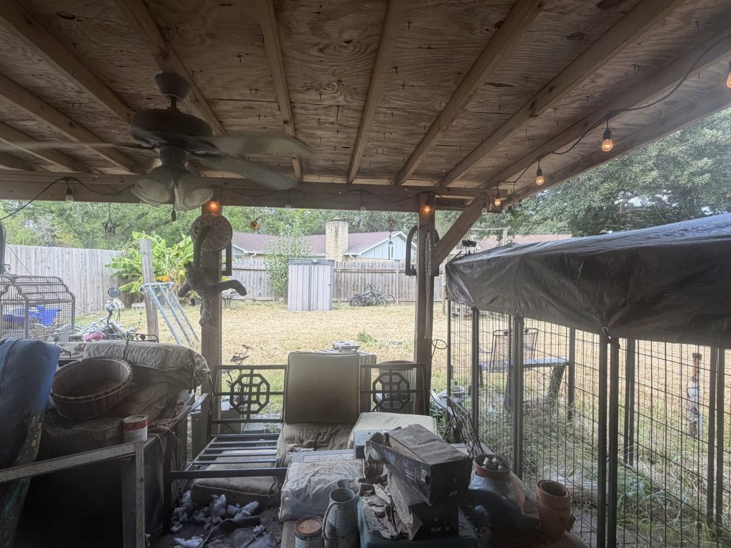 Back porch storage area in a Quail Valley East home in Missouri City, TX