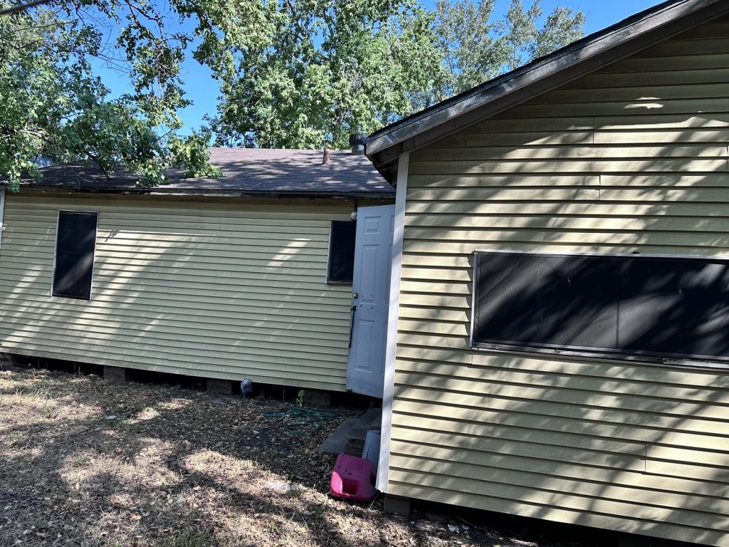 Side exterior of a Denver Harbor home in East Houston, TX purchased for cash