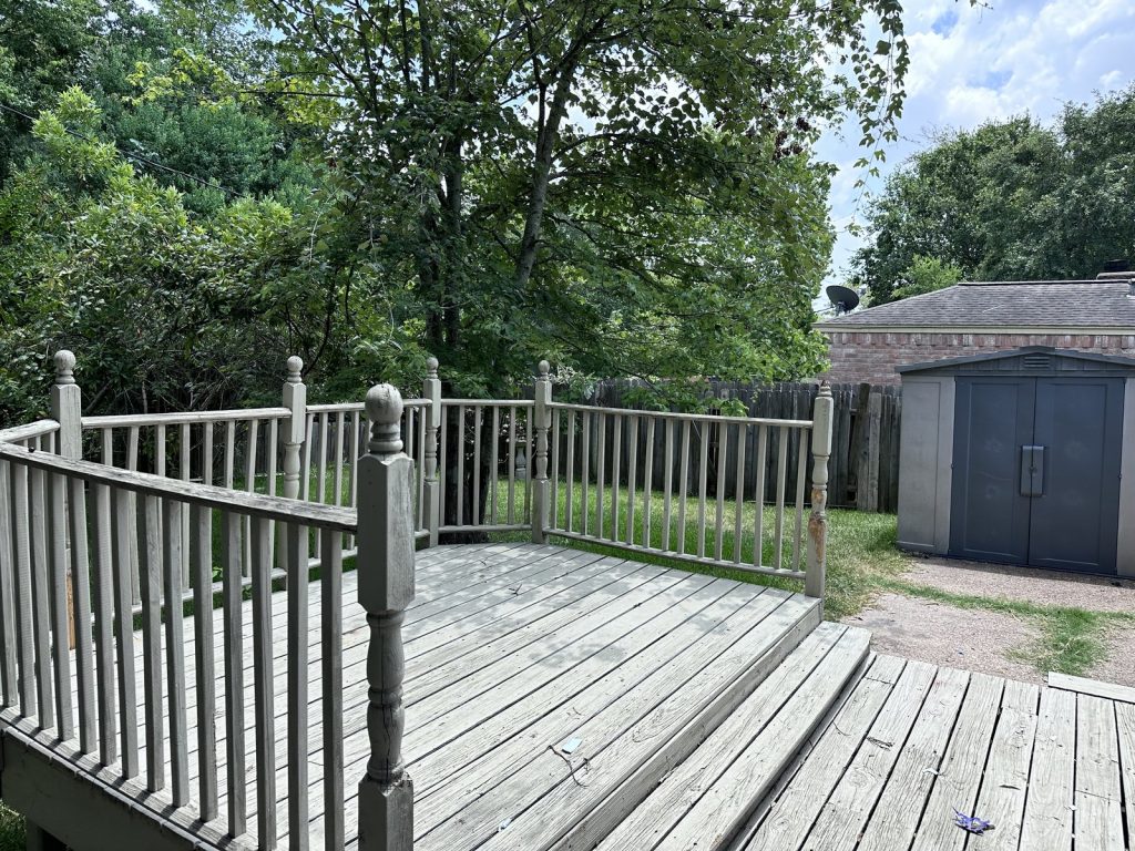Backyard deck at a Timber Lane rental home in Spring, TX purchased for cash