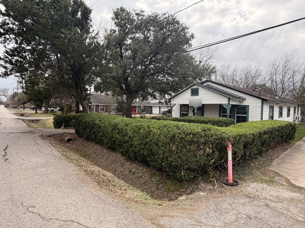 Corner lot view of as-is inherited home purchased in Brookhaven, Houston TX