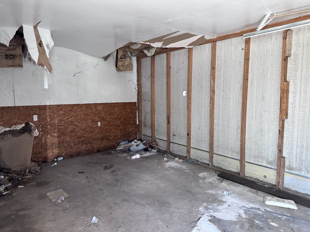 Interior damage from copper theft and vandalism inside a Greensbrook Place, Houston rental home