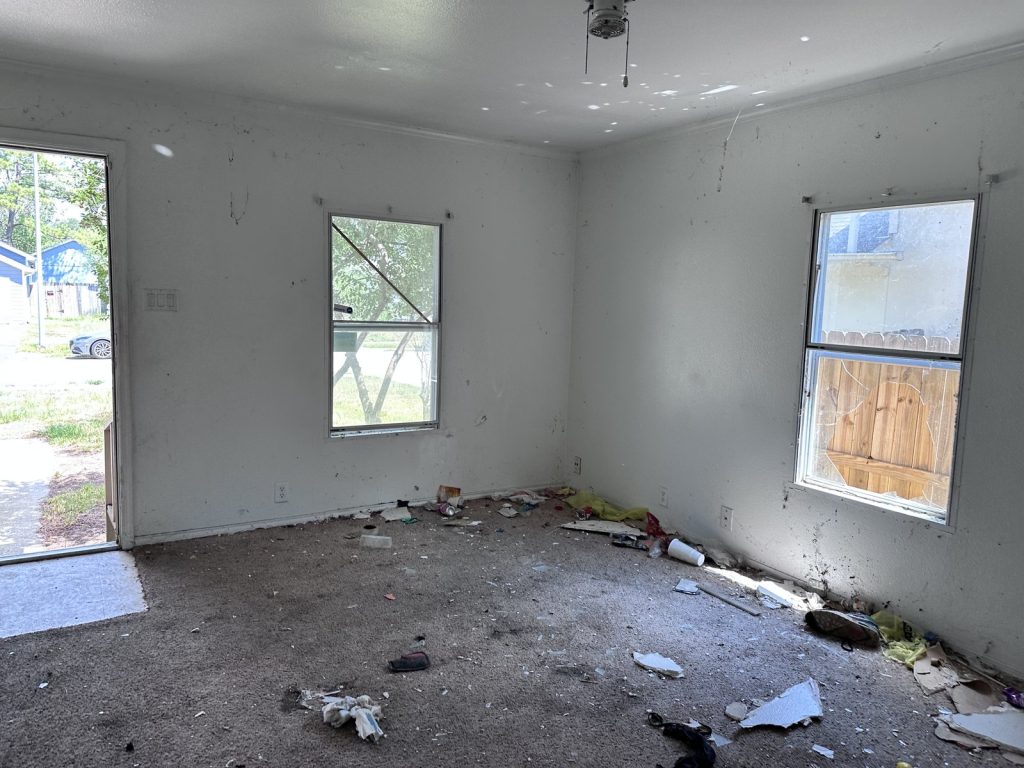 Vandalism debris and damage at a Greensbrook Place, Houston rental property sold as-is