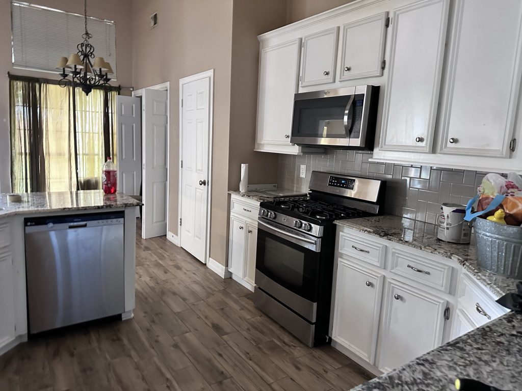 Updated white kitchen at a move-in-ready home in Spring, TX purchased for cash