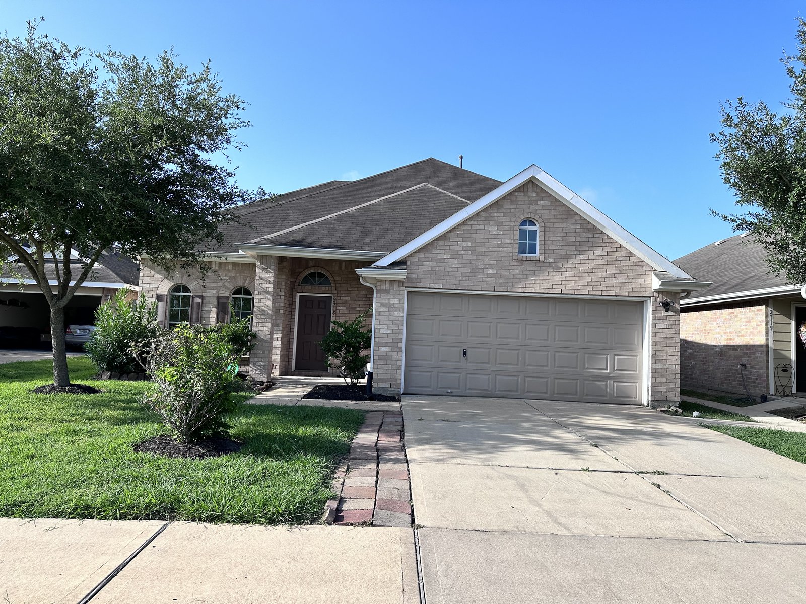 Front of brick home bought for cash in Central Southwest, Houston TX