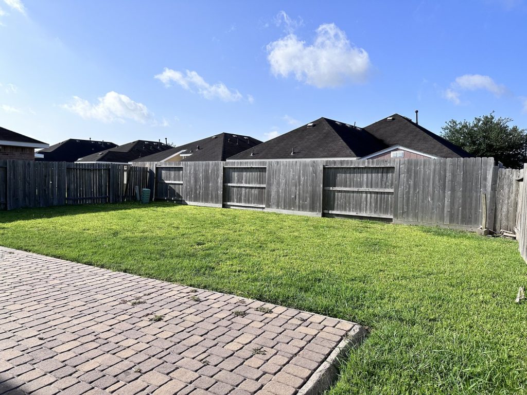 Empty living area of vacant house purchased as-is in southwest Houston TX