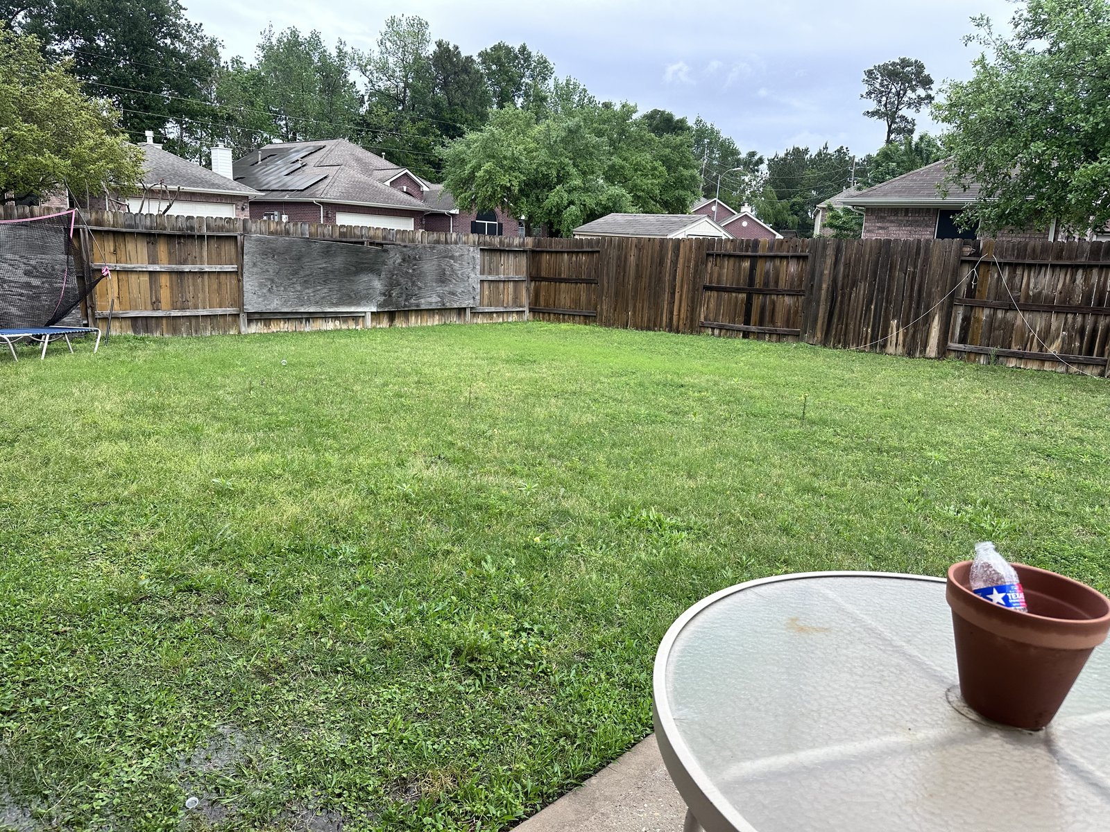 Large fenced backyard at a Greengate Acres home in Spring, TX sold for cash