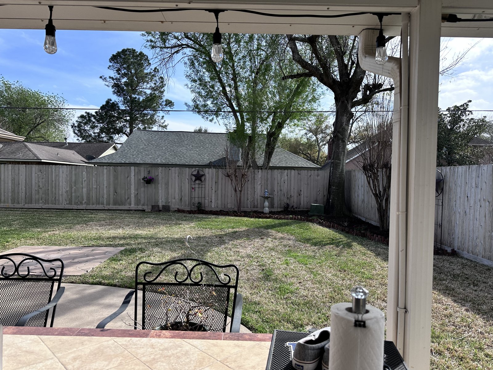 Backyard patio of a well-kept Cimarron home in Katy TX sold for cash by Volcan Property Buyers