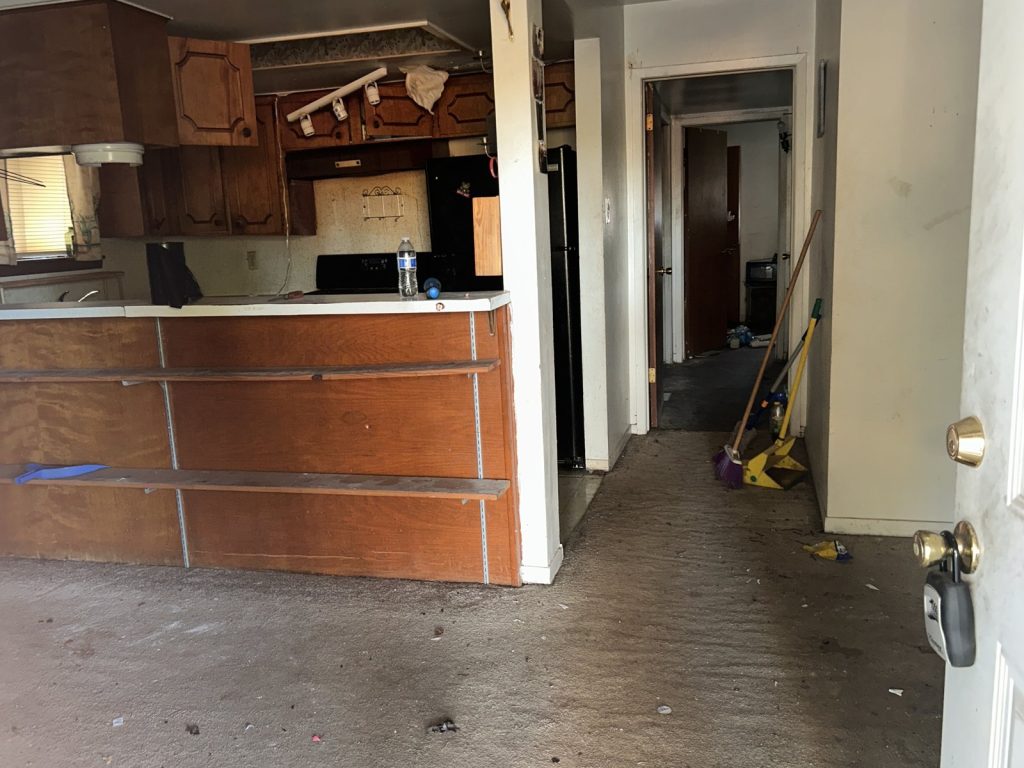 Neglected kitchen in an abandoned inherited home purchased for cash in Willow Run, Houston, TX