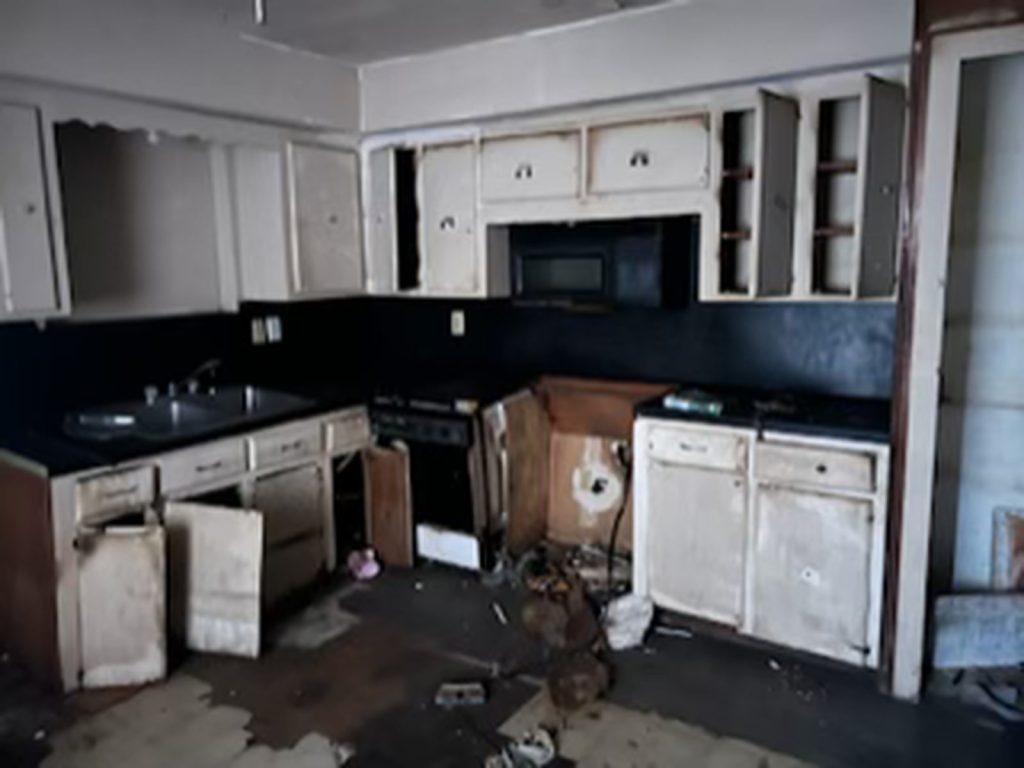 Damaged kitchen cabinets inside a Hempstead, TX property purchased for cash