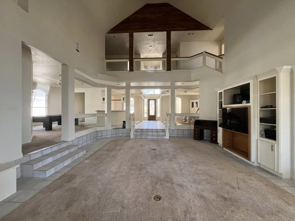 Two-story great room with loft in a Point Aquarius estate home near Willis, TX