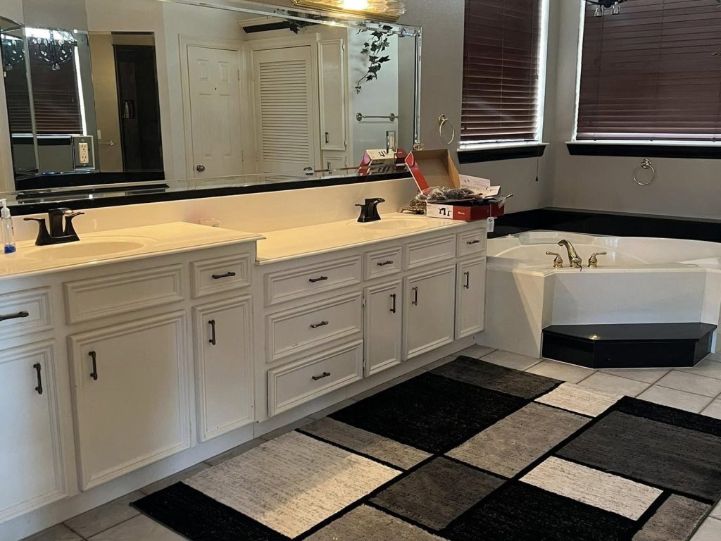 Primary bathroom with corner tub in a Lake Vista Drive home near Lake Conroe, TX