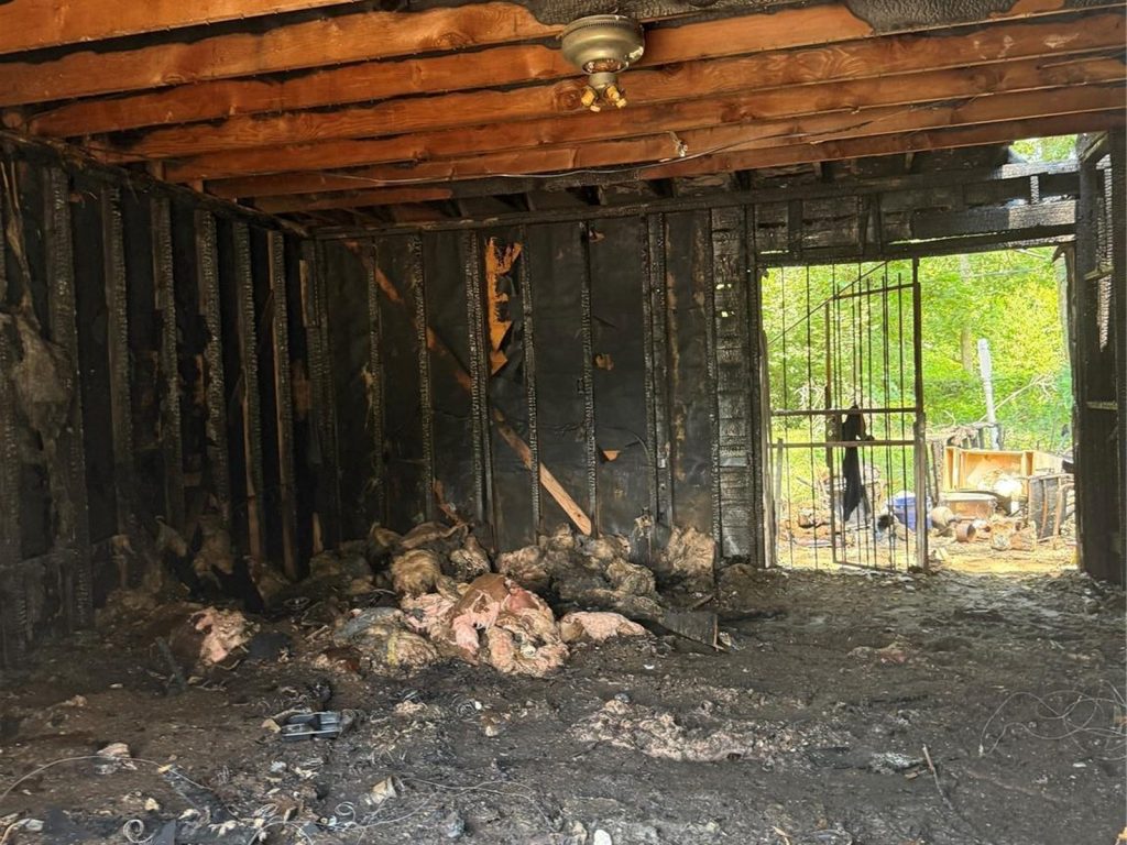 Interior fire damage inside an abandoned East Little York, Houston home sold as-is
