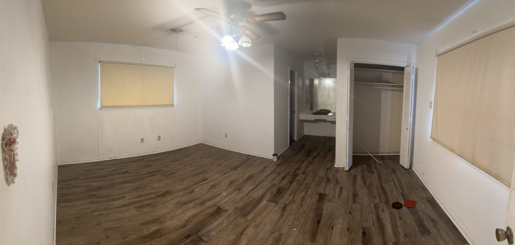 Empty bedroom with closet of vacant Baytown TX home purchased as-is by cash home buyers