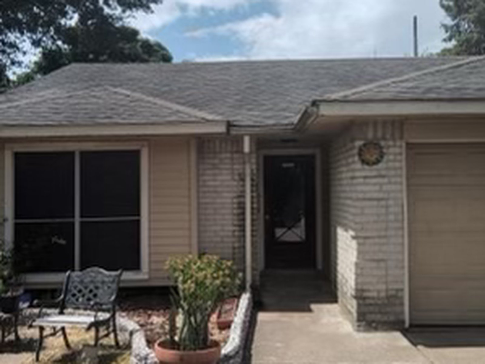Front exterior of a rental home in Chimney Hill, Cypress TX sold as-is for cash