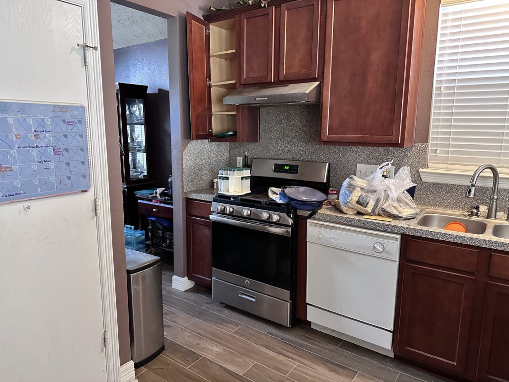 Occupied kitchen in a home sold discreetly for cash in Dayton, TX