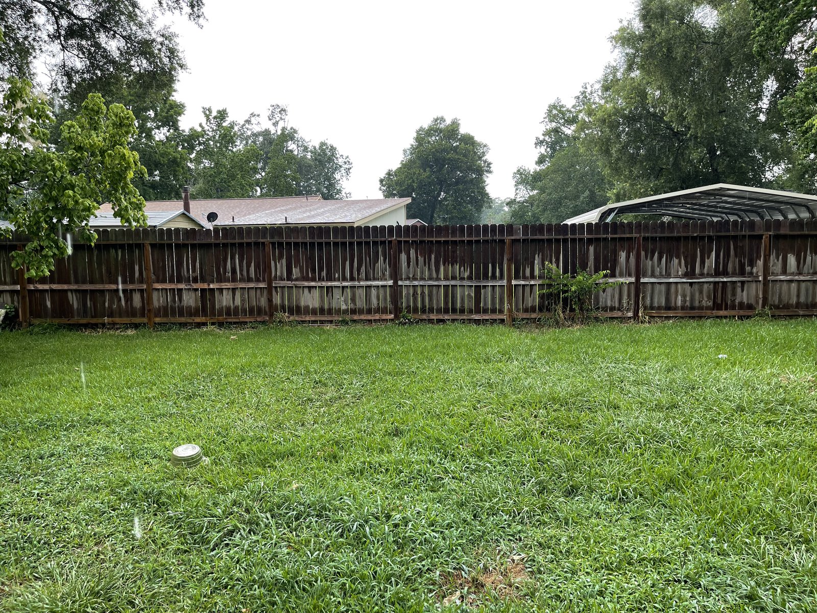 Backyard exterior of a rental home in the Newport subdivision near Crosby, TX bought for cash