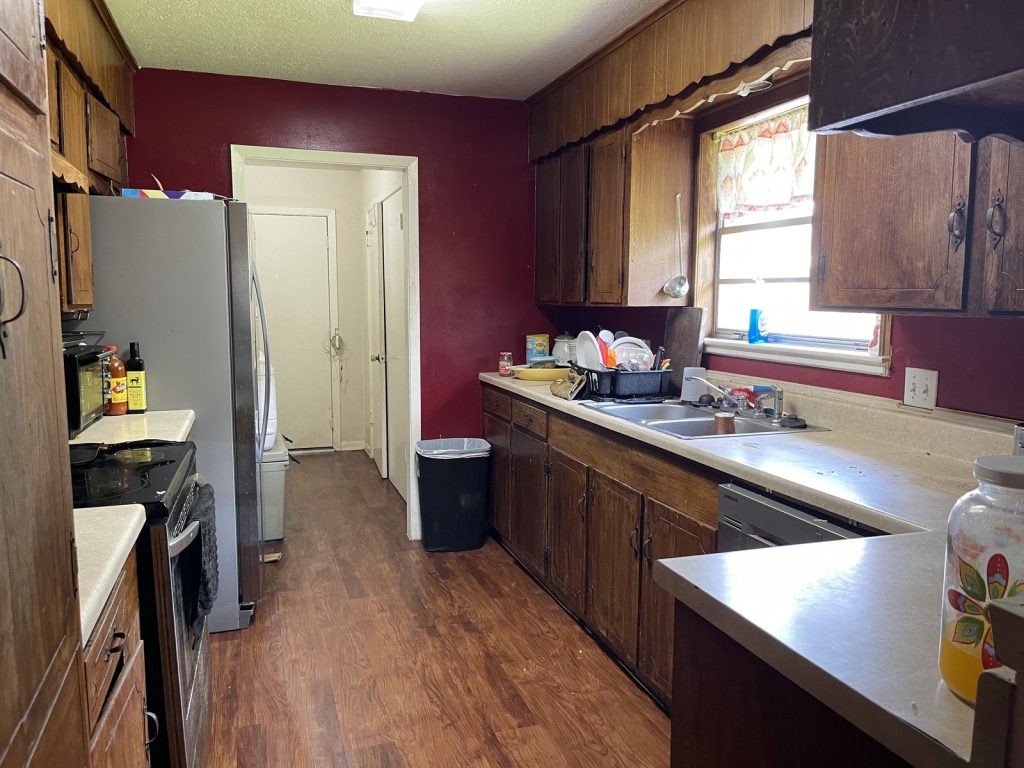 Original galley kitchen in tenant-occupied Houston TX rental sold for cash