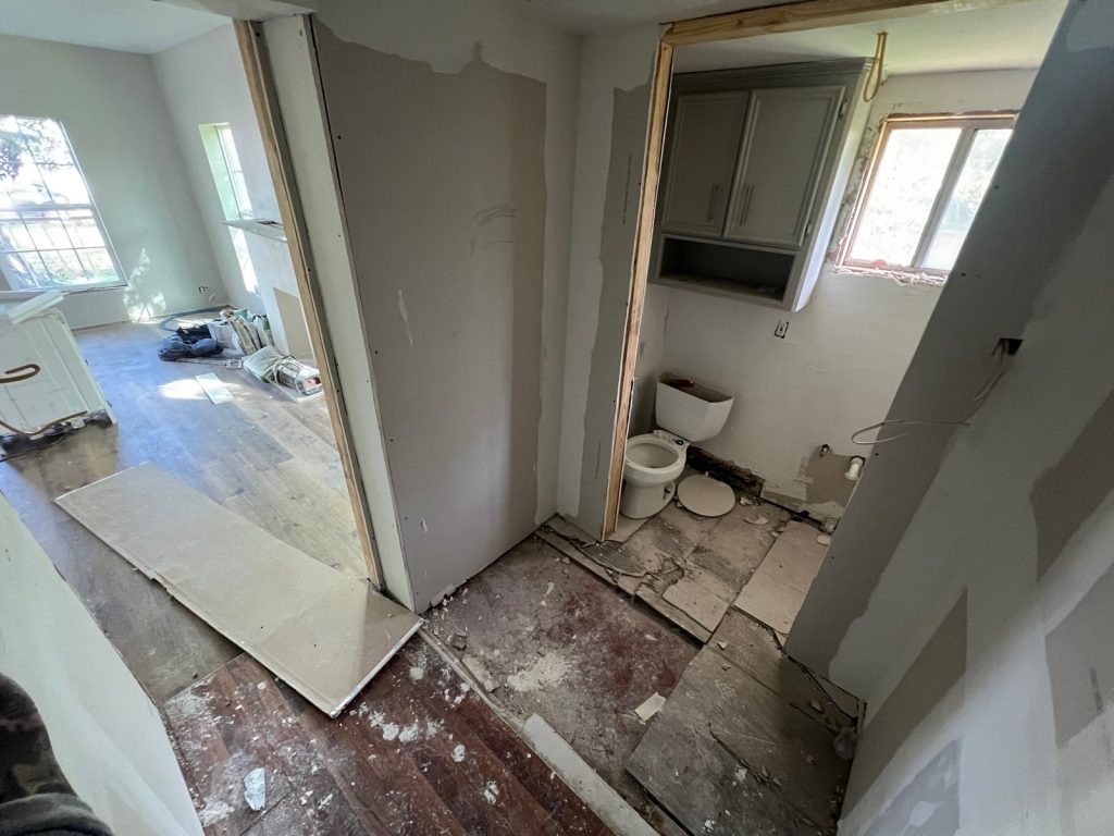 Stripped bathroom mid-renovation in a tired-landlord property in Eastwood, Houston, TX