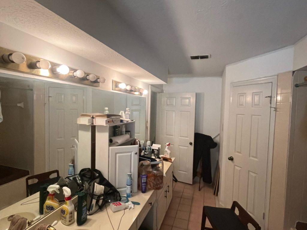 Bathroom vanity inside an Inwood North, Houston home sold in a quick cash close