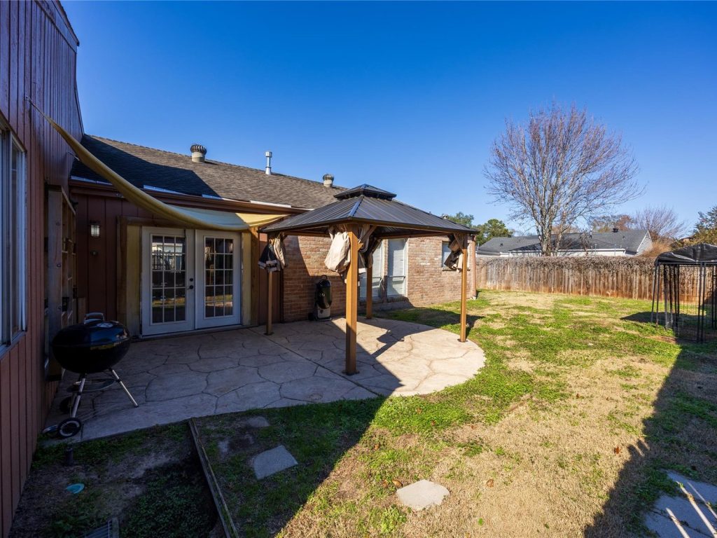 Back patio and gazebo at a Bear Creek Village Houston TX home bought by cash home buyers