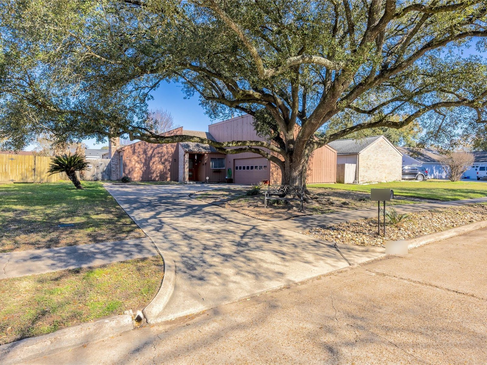Corner-lot home under a live oak bought for cash in Bear Creek Village, Houston TX