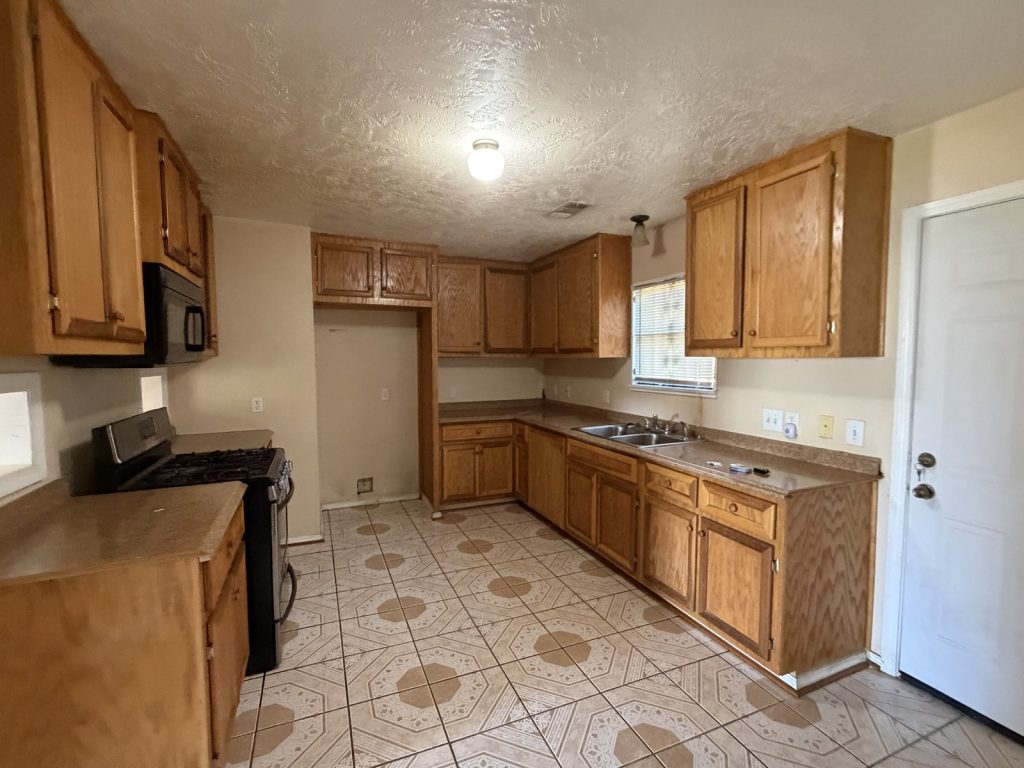 Oak kitchen in inherited Houston TX rental sold as-is for cash