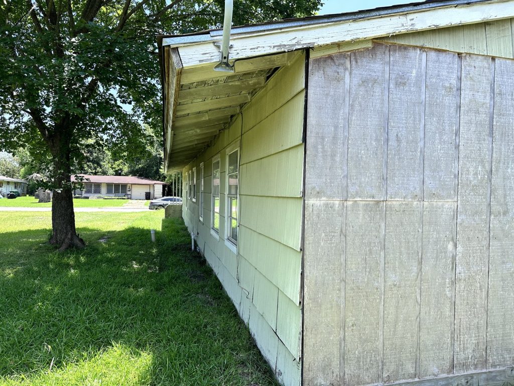 Missing wood shingle siding on as-is inherited house in South Park, Houston TX