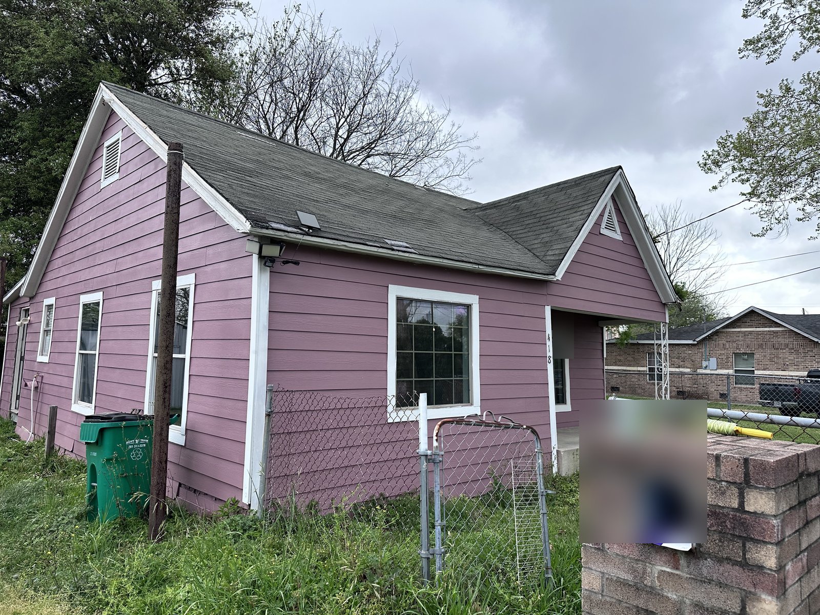 Front exterior of rental home bought for cash as-is in Baytown TX