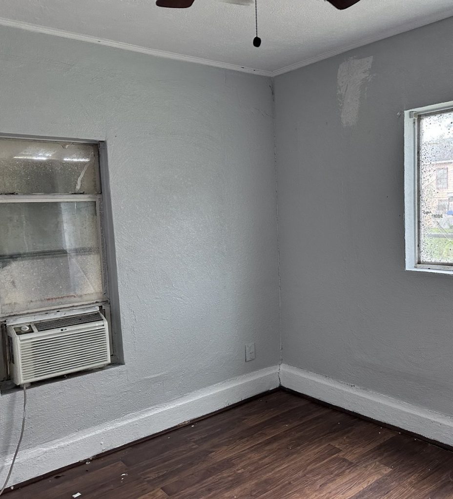 Unfinished repair work and exposed framing in as-is Baytown TX rental bought by Volcan Property Buyers