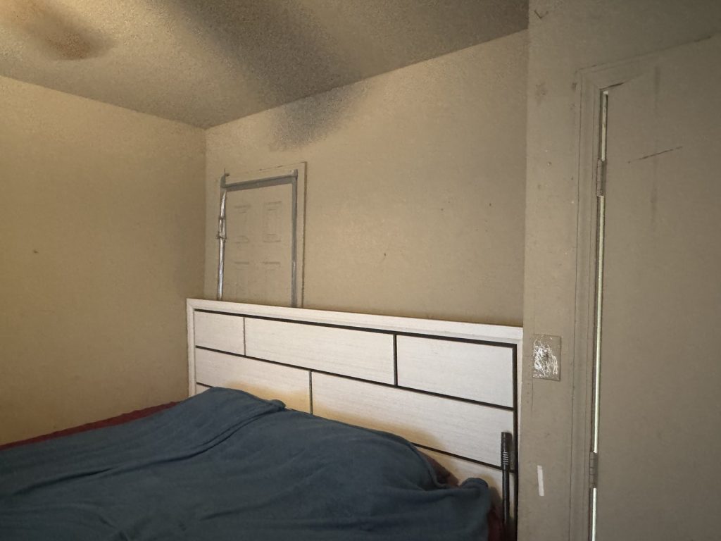 Bedroom ceiling water stain at a Richmond, TX rental home sold as-is