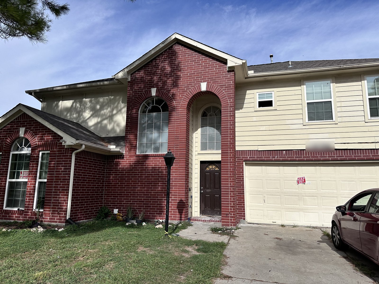 Two-story brick home with fire damage in Houston, TX purchased for cash by Volcan Property Buyers
