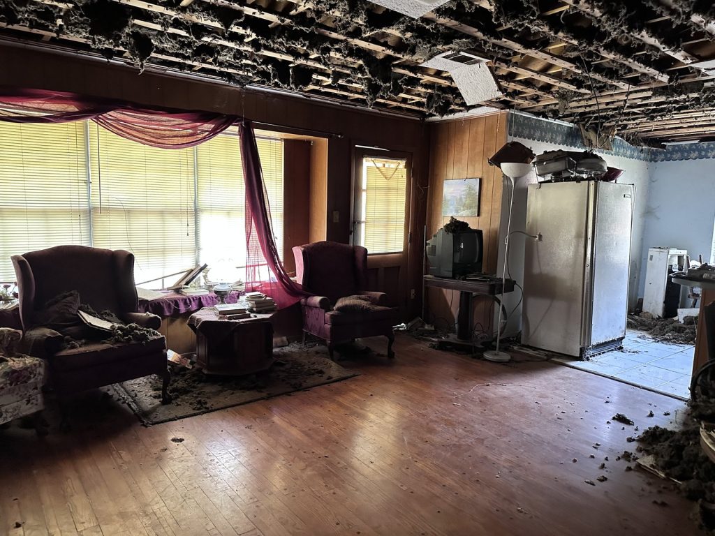 Collapsed living room ceiling in as-is Houston TX home purchased for cash