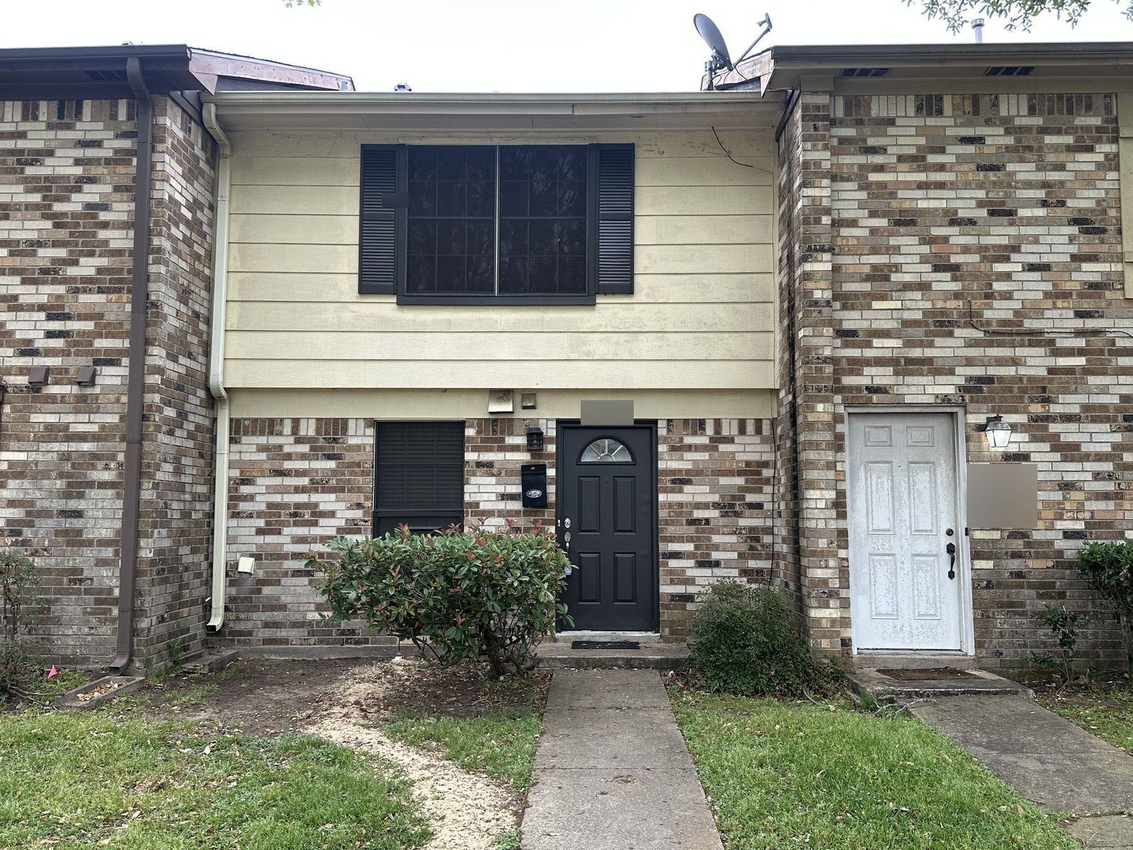 Front exterior of a Garden Walk rental townhome in La Porte, TX sold as-is for cash