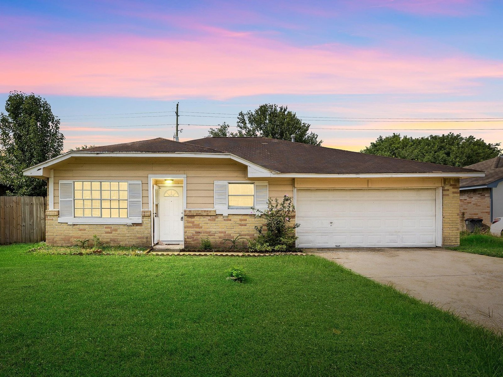 Twilight front exterior of a rental home in Paddock, Cypress TX sold as-is for cash