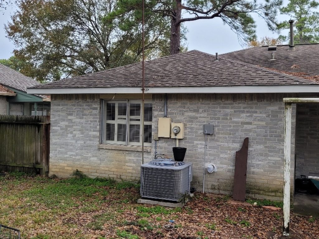 Exterior and AC unit at a Charterwood home in Spring, TX sold for cash
