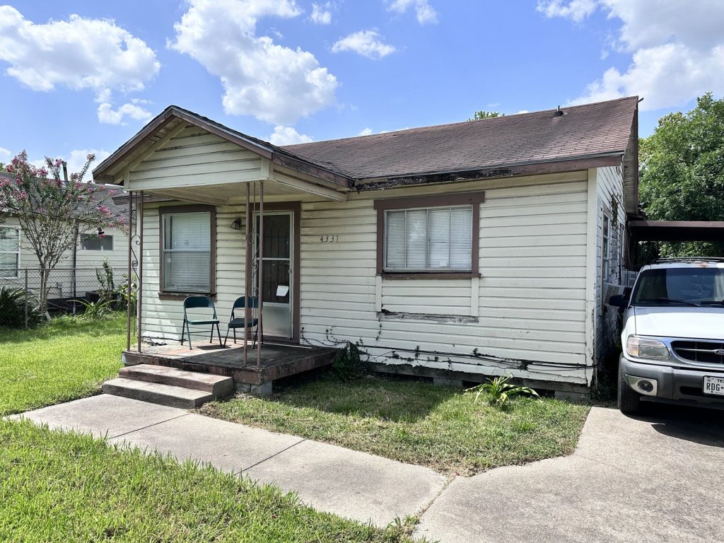 Cluttered storage room inside a Trinity/Houston Gardens, Houston fixer-upper sold as-is