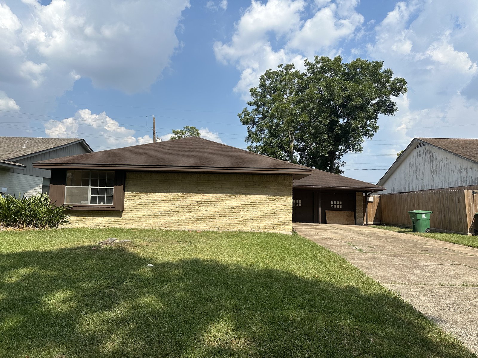 Front of flood-damaged brick ranch home bought for cash in Edgebrook, Houston TX