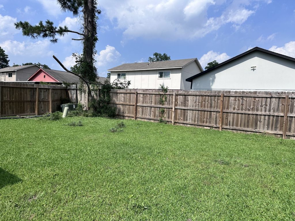Backyard of a fire-damaged rental sold as part of a portfolio deal in Parkwood East, Houston, TX