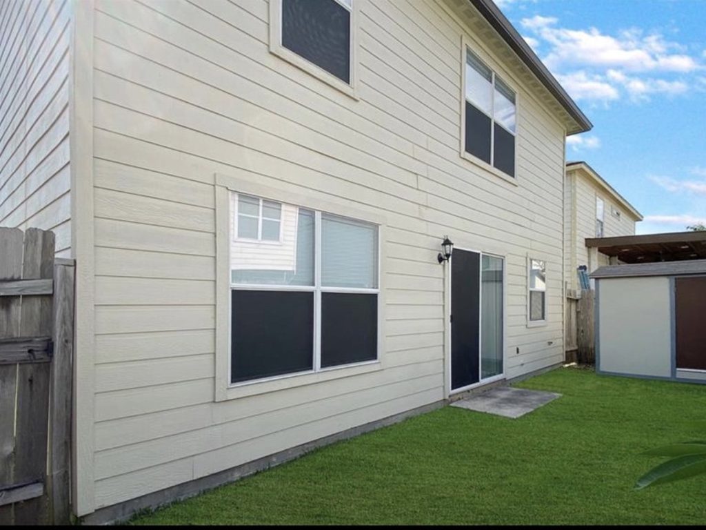 Backyard of tenant-occupied Houston TX rental property purchased as-is