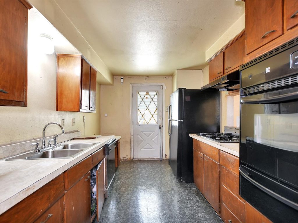 Original 1960s kitchen in inherited Southglen Houston TX house sold as-is