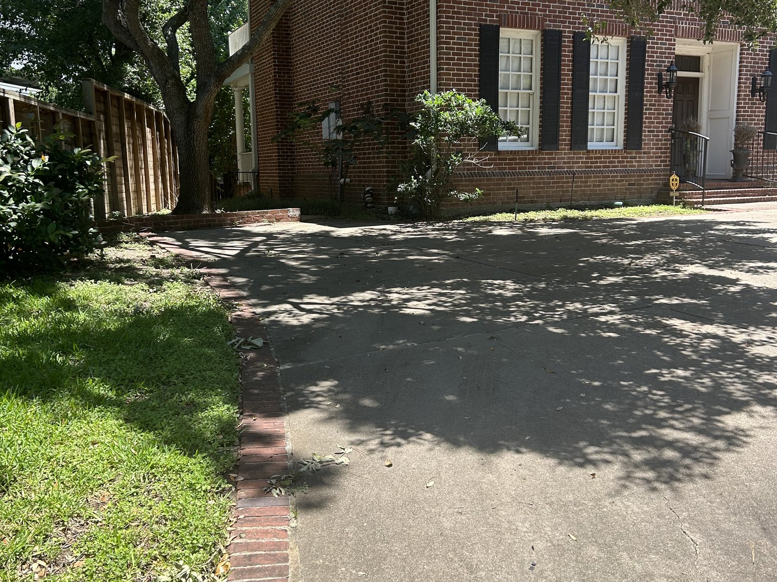 Front of a red brick traditional home bought for cash in Memorial Thicket, Houston TX