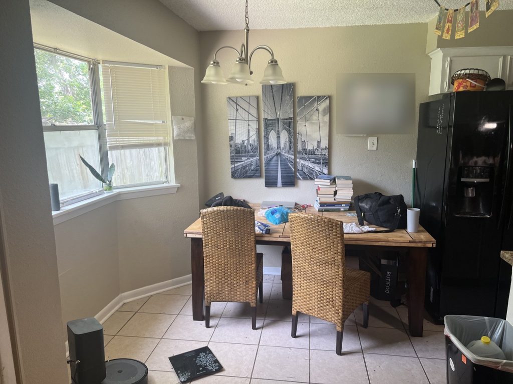 Occupied dining area in tenant-occupied Northwest Park Houston TX home sold for cash