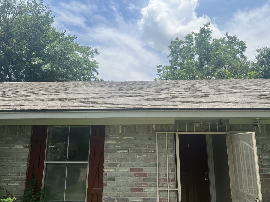 Weathered roofline and fascia on Northwest Park Houston TX rental sold as-is