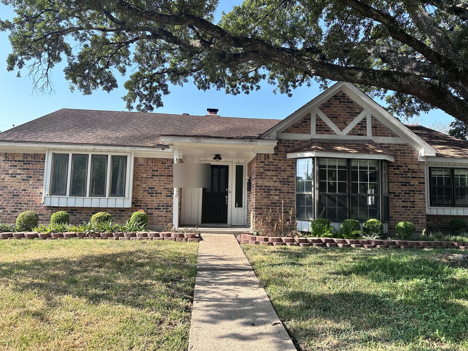 Front view of vacant home bought for cash in Forest West, Houston TX