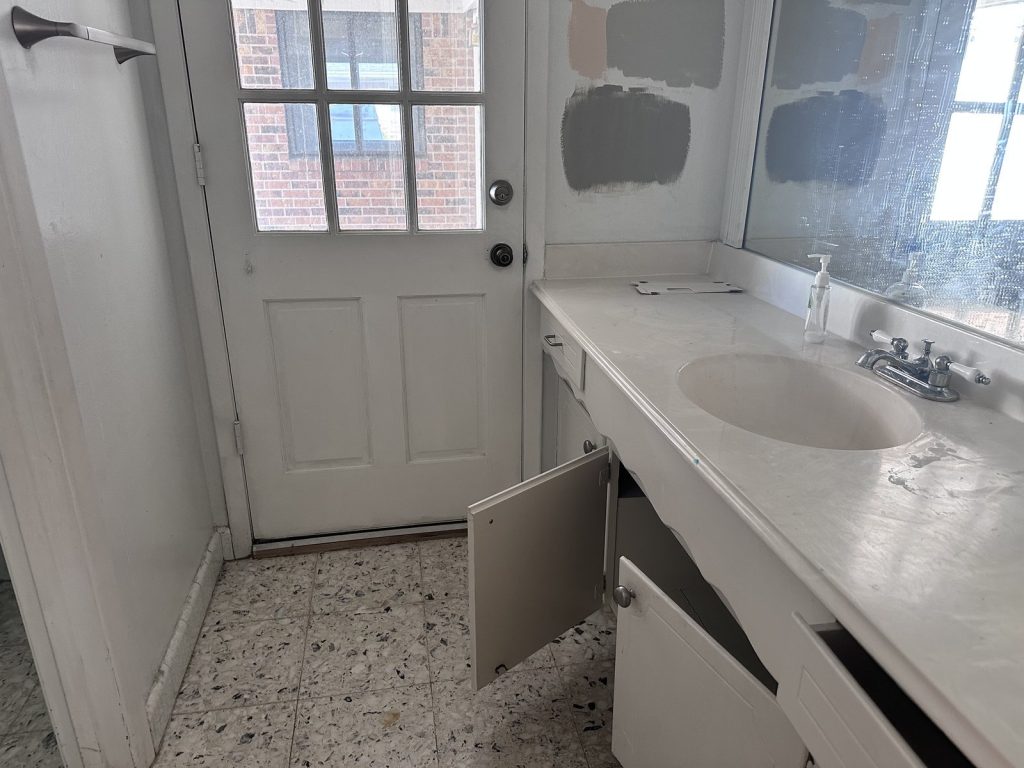 Utility bath with unfinished paint testing in Houston TX home bought by cash home buyers